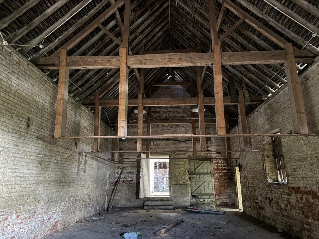 Lot: 109 - FREEHOLD BARN COMPLEX ON ALMOST THREE QUARTERS OF AN ACRE WITH POTENTIAL - Inside the long barn 2
